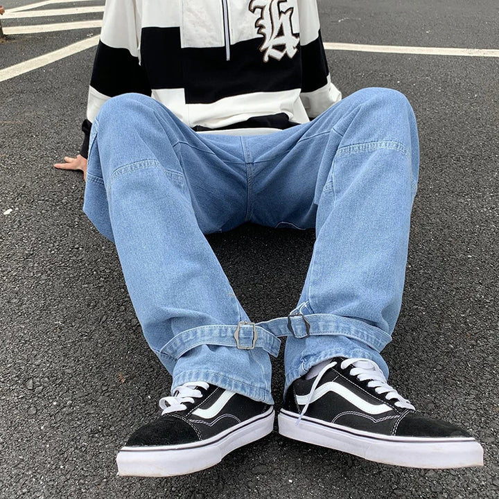 Man wearing baggy jeans men's cargo pants with patchwork design in a casual outdoor setting.