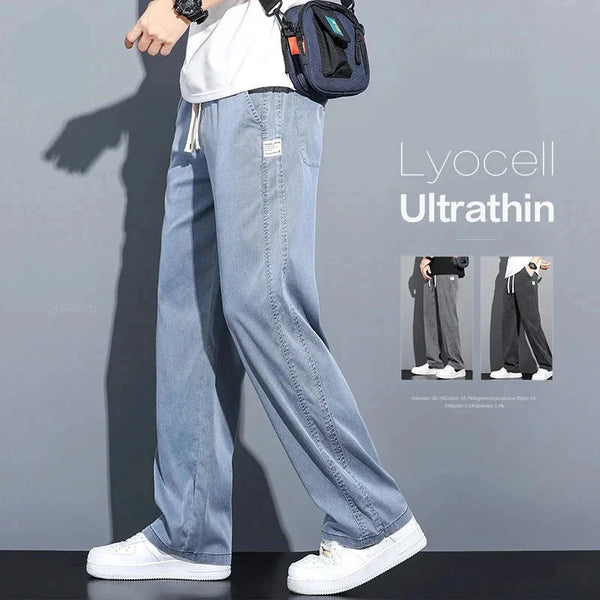 Casual drawstring men's light jeans trousers in lyocell fabric ultra-thin material modeling with side pockets on display