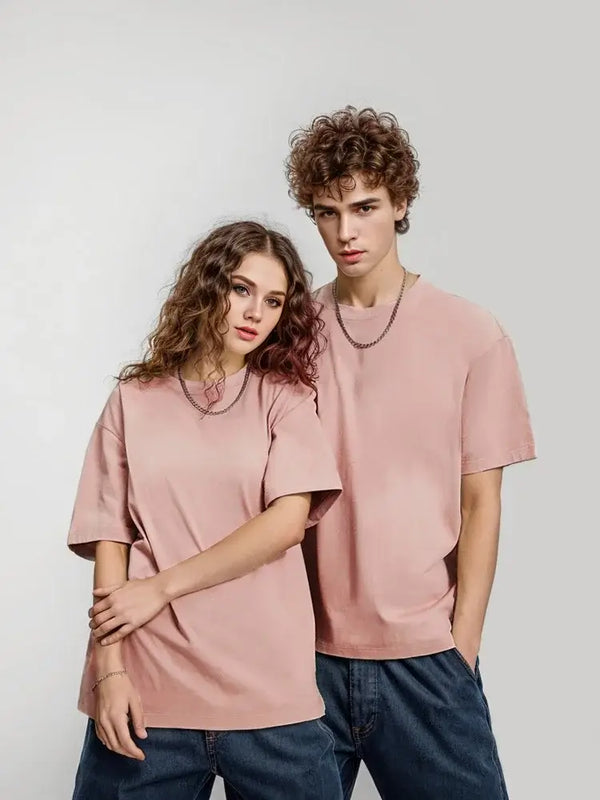 unisex models wearing pink oversized cotton t-shirts from the unisex collection