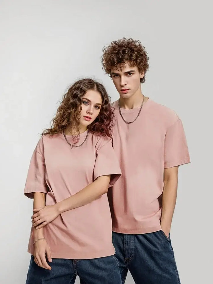 unisex models wearing pink oversized cotton t-shirts from the unisex collection