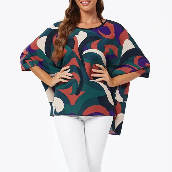 Plus size women batwing sleeve summer top in vibrant multicolor design, styled for comfort and elegance.