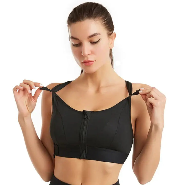 Model showcasing a front zipper high impact sports bra designed for plus size women, highlighting comfort and support.