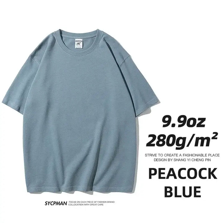 Oversized unisex cotton t-shirt in peacock blue, 280gm fabric, casual and comfortable design.