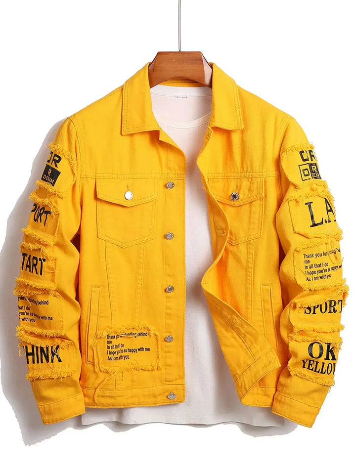 Yellow denim jacket with text patches on sleeves, featuring distressed design and button-up front, displayed on hanger.