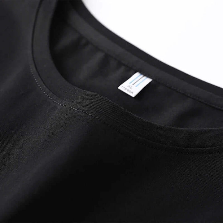 Close-up of the neckline and label of a comfortable black plus size tank top for men.