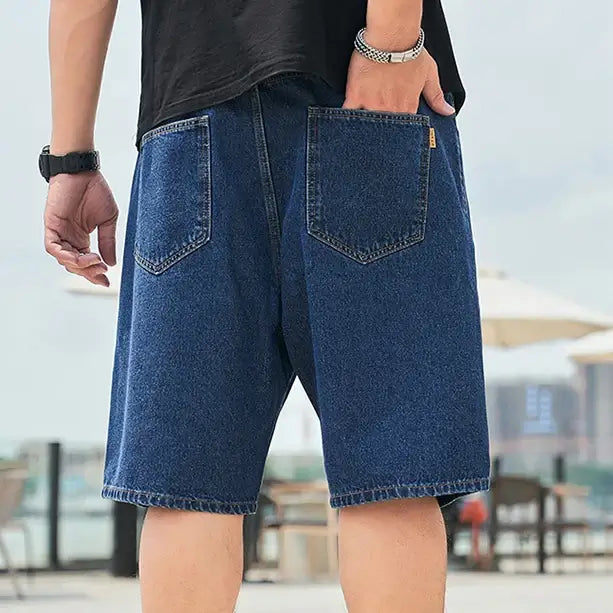 Men's plus size denim shorts for summer casual wear, featuring a relaxed fit and solid jeans color.