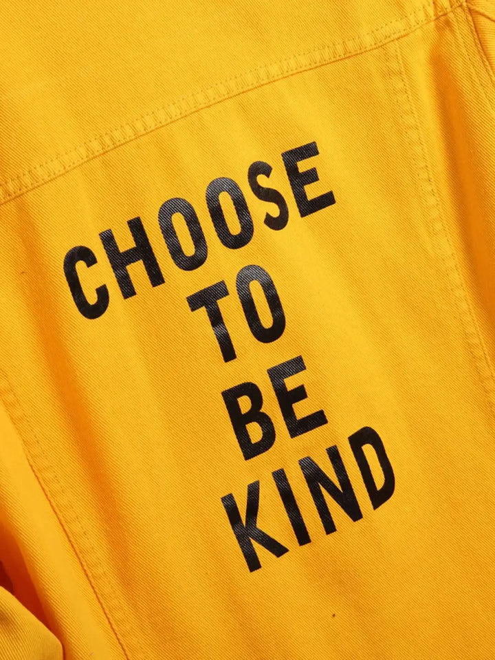 Yellow jacket with "Choose to be Kind" message printed in bold black letters.