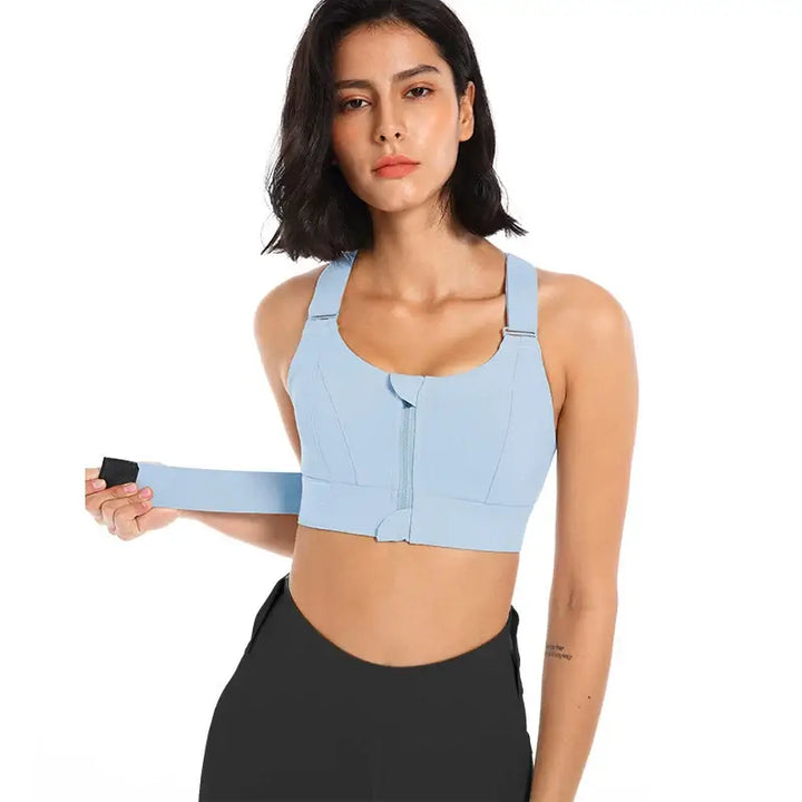 Front zipper high impact sports bra for plus size women in light blue, designed for comfort and support during workouts.